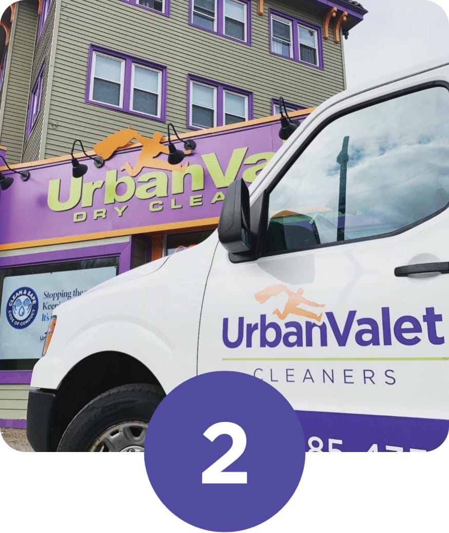 Urban Valet delivery van parked in front of the Elmwood Ave store location of Urban Valet