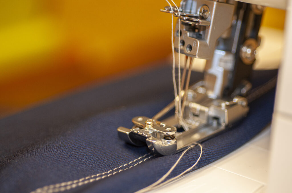 a photo of a sewing machine sewing a seam